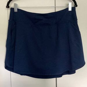 Ladies skort next to new navy blue